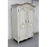 A contemporary ivory painted French armoire-style wardrobe,