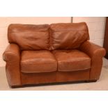 A contemporary 'Iolono' two-seater Italian leather sofa, width 160cm.