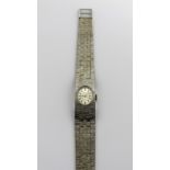 Bentimo; a 9ct white gold ladies' wristwatch with bark design bracelet strap,