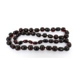 A graduated cherry amber bead necklace comprising forty-seven beads, approx 136g.