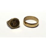 A gentlemen's 9ct gold wedding band, size W and a thaler 1853 coin in gold mount, size M,