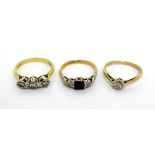 Three 18ct gold dress rings; one set with central square sapphire and two small diamonds, size L,