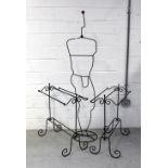 A pair of black wrought iron decorative towel rails and a decorative wrought iron mannequin,