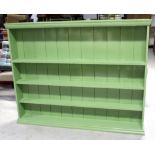 A large green-painted plate rack, width 180cm, height 142cm.