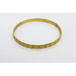 A yellow metal bangle, approx 7.3g.