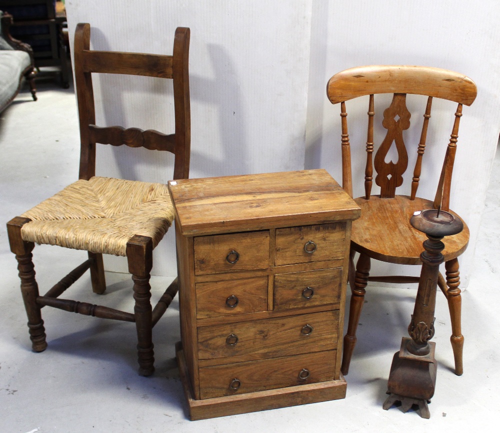 A 20th century Indian hardwood chest of small proportions with four small drawers over two larger