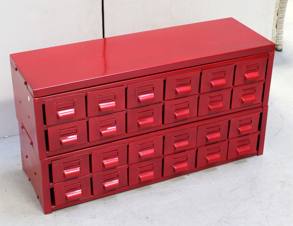 A rectangular metal chest with twenty-four filing drawers, re-sprayed in pillar box red, 53 x 92cm.