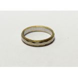 An 18ct white and yellow gold wedding band, size P, approx 4.4g.