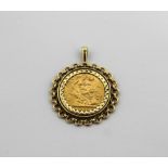 An Elizabeth II full sovereign,1965, in a 9ct gold scrolling pendant mount, approx 12.6g.