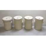 Four large early 20th century Royal Doulton cream ground pots with lids (one af) (4).