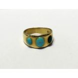 A yellow metal ring set with three turquoise stones, marked '18' and script, approx 6.4g.