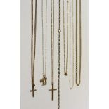 Seven gold chains to include two 9ct gold chains with cross pendants, a fine chain with pendant,