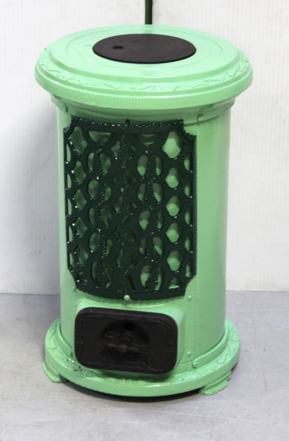 A late 19th/early 20th century cast iron fire stove,