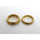 Two 22ct gold ladies' wedding bands, size M and K, approx combined 15.2g (2).
