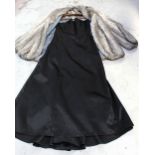 A black satin strapless evening gown and a vintage grey fur jacket with roll collar (2).