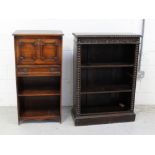 An oak stained Gothic-style bookcase, two shelves on plinth base,