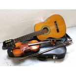 A Spanish acoustic guitar with soft padded case,