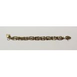 A 9ct gold four-bar gate bracelet with padlock clasp and a 9ct gold teapot charm,