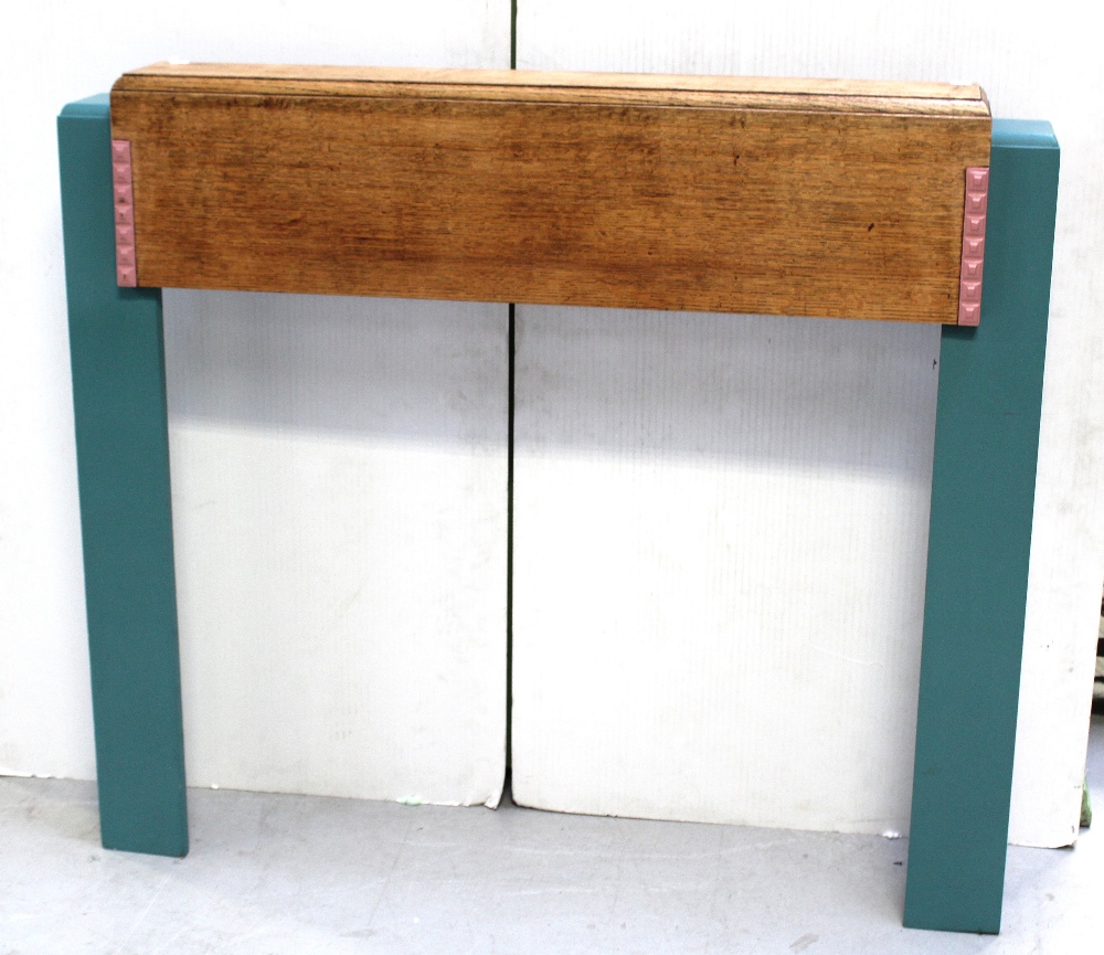 An Art Deco style oak and painted fire surround, width 124cm.