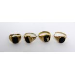 Four 9ct gold dress rings, all set with onyx stones; one with a gold Bunny Club motif,