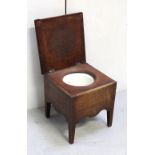 A 19th century mahogany commode with hinged lid enclosing ceramic liner.