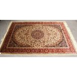 A beige ground Heriz rug, 190 x 140cm.