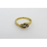 An 18ct gold ring with three collet-set diamonds, size Q 1/3, approx 3.7g.