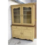 A 20th century French hand-painted yellow and distressed glazed cabinet by 'The One',