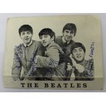 A Beatles Official Fan Club card signed by a secretary on behalf of all four Beatles.