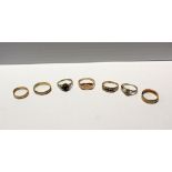 Two 9ct gold wedding bands, three 8ct gold dress rings; one floral-set with blue and white stones,