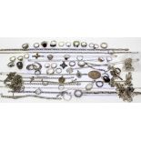A quantity of silver and white metal jewellery to include rings, chains, pendants, lockets,