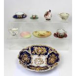 A large 19th century cobalt blue ground bowl, with floral and gilt-heightened decoration,