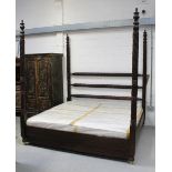 A 20th century Indian hardwood Colonial-style king size bed, three turned and carved back rails,