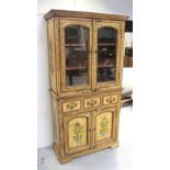 An Indian yellow-painted and waxed cabinet, hand-painted with floral decoration,