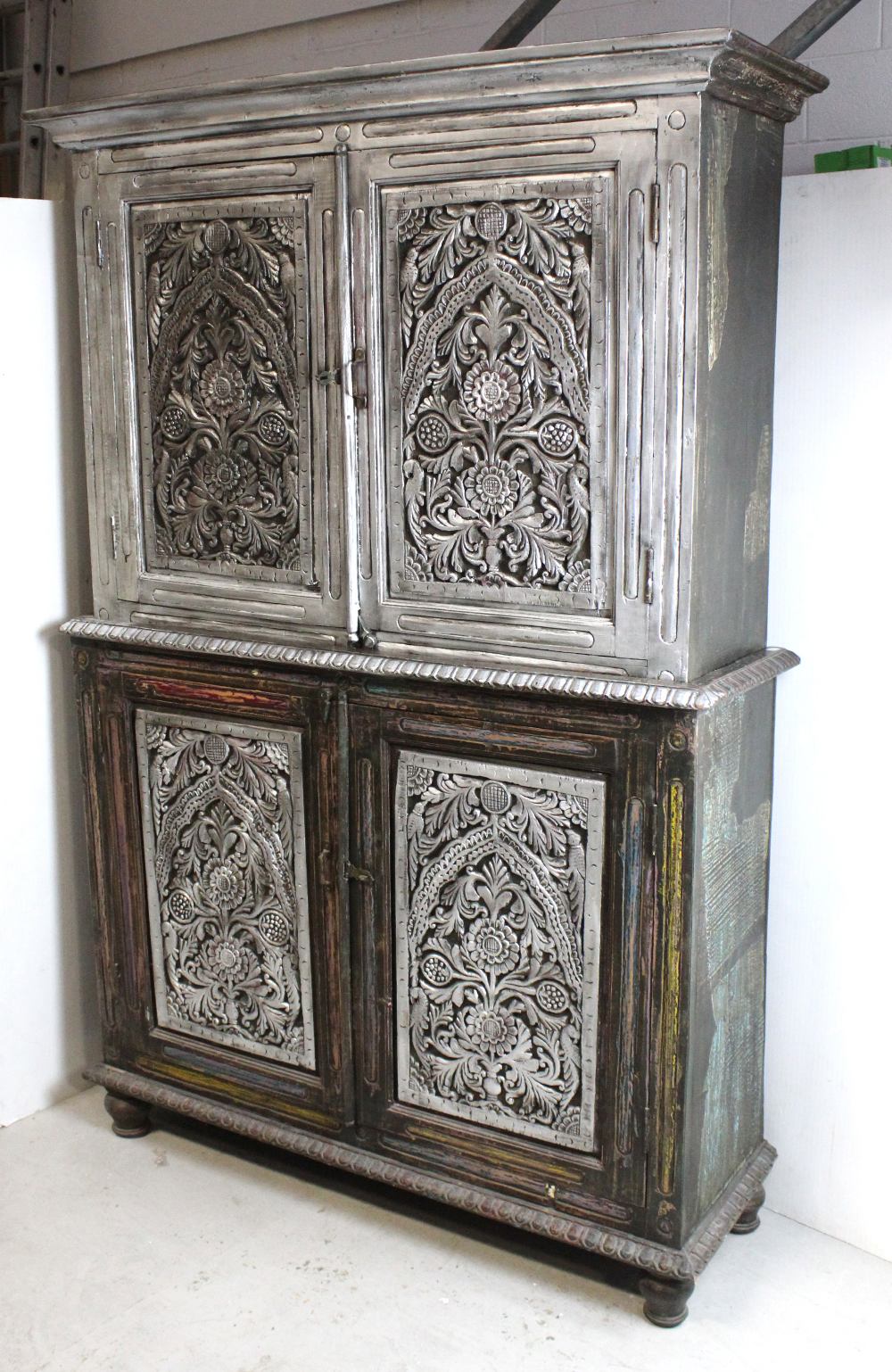 An Indian hardwood silver gilded two-tier cabinet,