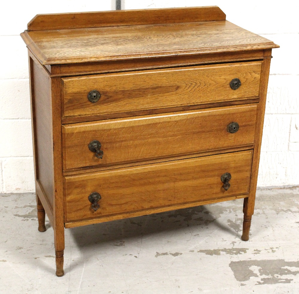 A mid-20th century oak three-drawer chest of drawers on turned supports, 90 x 90cm.