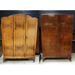 A c1930s walnut three-door wardrobe, raised on squat cabriole supports,