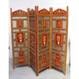 An Indian four-panel screen with lattice panels and hand-painted floral panels,