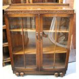 A c1930s glazed display cabinet, width 91cm.