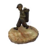 An early 20th century Lorenzl-style Austrian match striker/lighter in the form of a young golf