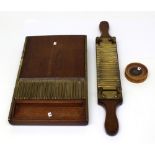 A late 19th century five-grain mahogany pill-making machine,