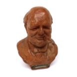 A mid-20th century striker/lighter in the form of Winston Churchill, made in England by Tallent,