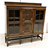 An early-to-mid 20th century oak display cabinet/bookcase,