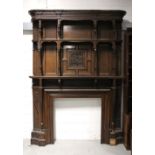 A late 19th/early 20th century oak Arts and Crafts style fire surround and mantel of large
