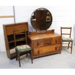 A c1950s dressing table with a large circular mirror, a c1950s oak bureau bookcase,