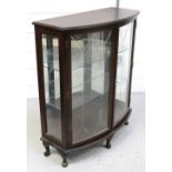 A reproduction bow-fronted display cabinet on cabriole legs, width 93cm.
