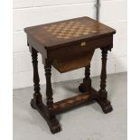 An early 19th century rosewood sewing/games table with checkerboard to top,