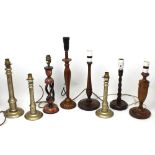 Nine vintage turned wooden table lamps, other ornamental lamps and a metal desk lamp.