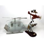 A glass and chromed metal lamp modelled as a helicopter,