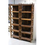A pair of Indian hardwood display/book shelves, cross decoration to sides with five shelves,